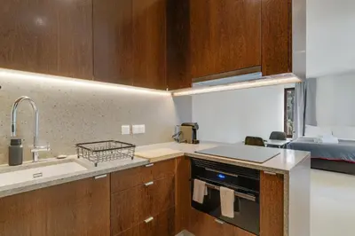 a kitchen with a sink and a stove top oven at Urso Tigre Apartment by Holiday Rental Madeira in Funchal