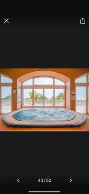 a picture of a room with a large window at Fairviews Boavista , Boavista golf and spa resort Lagos in Lagos