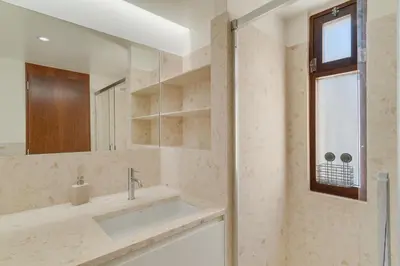 a bathroom with a sink and a mirror at Carlos Apartment by Holiday Rental Madeira in Funchal