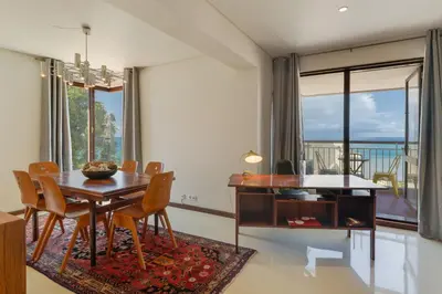 a dining room with a table and chairs with a view at Carlos Apartment by Holiday Rental Madeira in Funchal