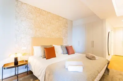 a bedroom with two beds in a room at Satoshi Ocean View in Funchal