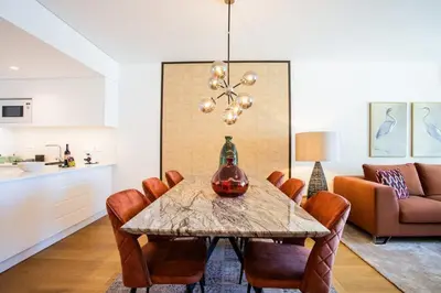 a dining room with a table and chairs at Satoshi Ocean View in Funchal