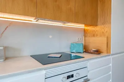 a kitchen counter with a blue box on it at FLH Funchal Terrace Studio in Funchal