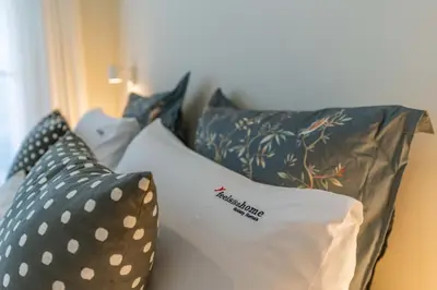 a group of pillows sitting on a couch at FLH Funchal Terrace Studio in Funchal