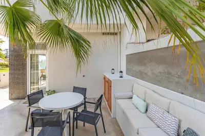 a living room with a white couch and a table at FLH Funchal Terrace Studio in Funchal