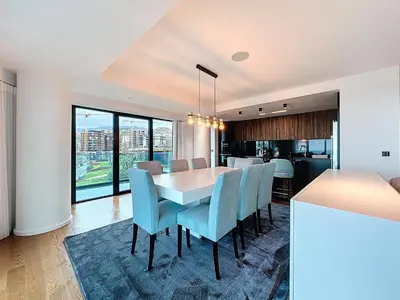 a kitchen and dining room with a table and chairs at Varinos Seaview Apartment in Funchal