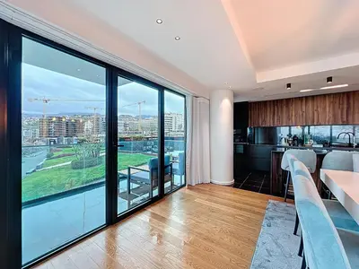 a living room with a view of a city at Varinos Seaview Apartment in Funchal