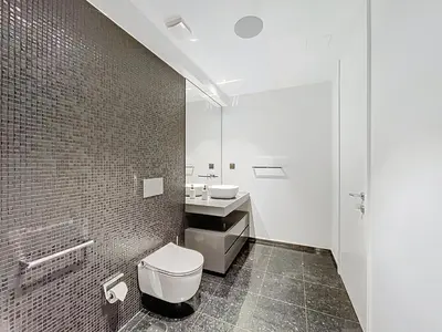 a bathroom with a toilet and a sink at Varinos Seaview Apartment in Funchal