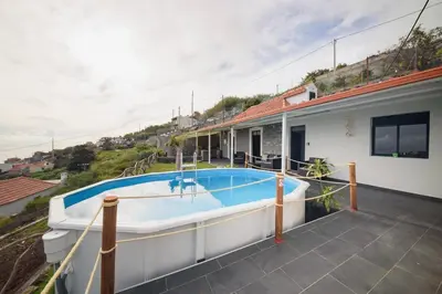 a swimming pool on the patio of a house at Casa do Vale by Mth in Ribeira Brava