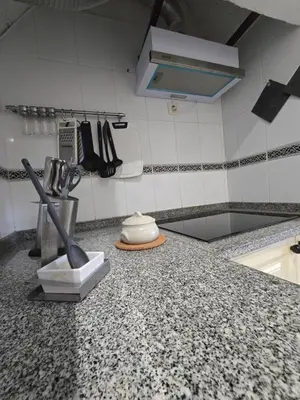 a kitchen with a counter top with a sink at Paz House in Caniço