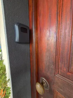 a door with a tv on the side of it at Paz House in Caniço