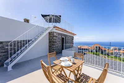 a tea kettle and a toaster sitting on a counter at Social Lodge Galinho House - Sea View - Calheta in Estreito da Calheta