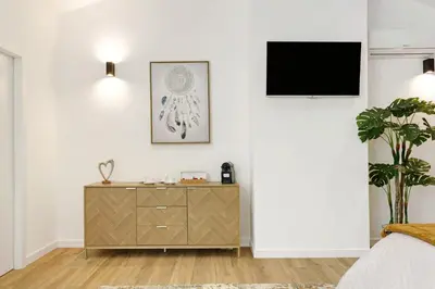 a bedroom with a bed and a yellow couch at Casa Belavista in Gaula