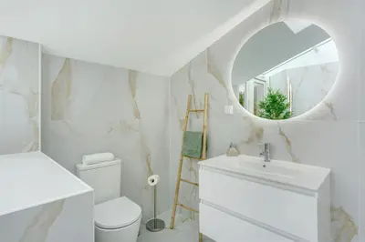 a bathroom with a window and a potted plant at Casa Belavista in Gaula