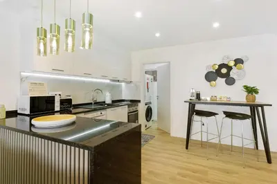 a kitchen with a counter top and a table at Casa Belavista in Gaula