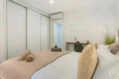 a bedroom with a large white bed with two pillows at Casa Belavista in Gaula