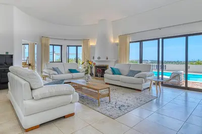 a living room with white furniture and a pool at Luxury Villa Lge Pool Hot Tub Beach in Falfeira