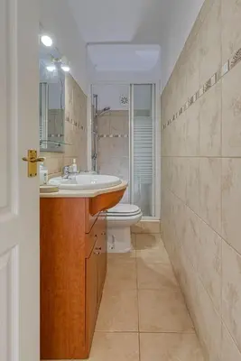 a bathroom with a sink and a toilet at Luxury Villa Lge Pool Hot Tub Beach in Falfeira