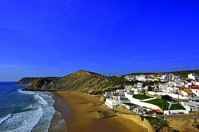 a view of a beach with houses and the ocean at Luxury Villa Lge Pool Hot Tub Beach in Falfeira