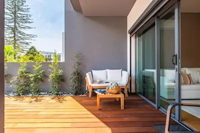 an outdoor patio with a chair and a table at Acquas Bliss by Homie in Funchal