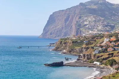 a view of a beach with a bridge on a mountain at Oceans Glow by Homie in Funchal