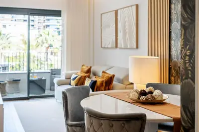 a living room with a table and a couch at Oceans Glow by Homie in Funchal