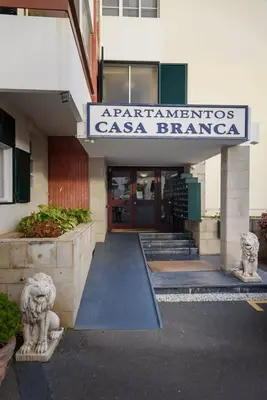 a building with a sign on the front of it at Casa Branca Apartment by Mth in Funchal
