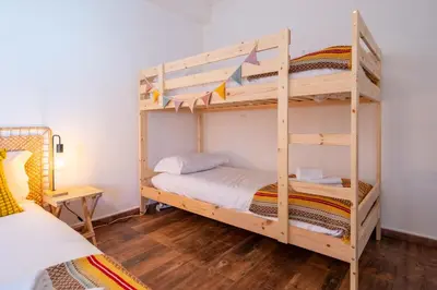 a bunk bed room with two bunk beds at Casa do Sol in Bordeira