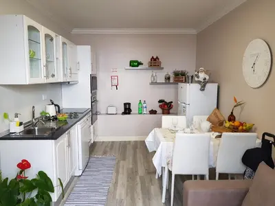 a kitchen and dining room with a table and chairs at Quinta do Bom Sucesso in Funchal