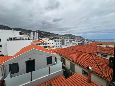 a view of a city with red roofs at Great Stay 3 Bedroom Funchal Central Retreat in Funchal