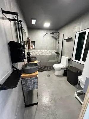 a bathroom with a sink and a toilet and a shower at Great Stay 3 Bedroom Funchal Central Retreat in Funchal