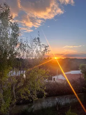 a view of the sunset from the roof of a house at Casa Salácia in Aljezur