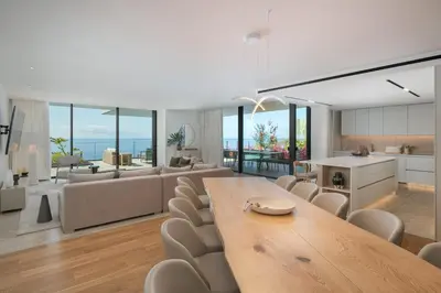 a bedroom with a white desk and a view of the ocean at Giluca Retreat in Funchal