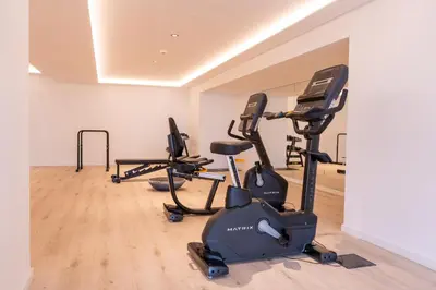 a gym with several exercise bikes in a room at Acqua Mar in Funchal