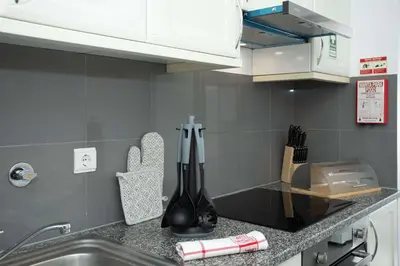 a kitchen with a sink and a counter top at Apartamento Janela do Atlantico in Machico