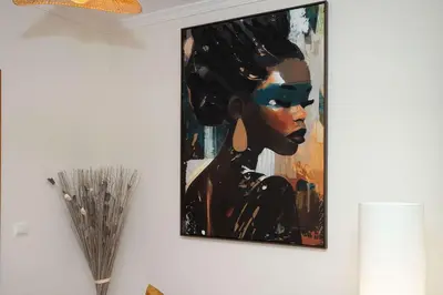 a painting of a woman on a wall at Apartamento Janela do Atlantico in Machico
