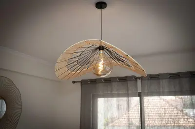 a ceiling light with a umbrella hanging from a ceiling at Apartamento Janela do Atlantico in Machico