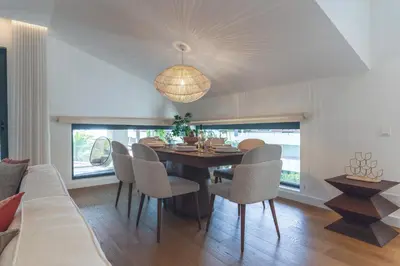 a dining room with a table and chairs at Babi by the Sea by Atlantic Holiday in Funchal