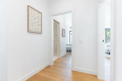a hallway with white walls and a picture on the wall at Babi by the Sea by Atlantic Holiday in Funchal