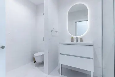 a white bathroom with a sink and a mirror at Babi by the Sea by Atlantic Holiday in Funchal