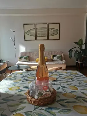 a bottle sitting on top of a bed at Surf Nest in Machico