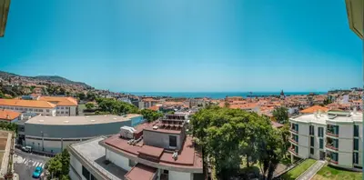 an aerial view of a city with the ocean at Elias Garcia T3 Apartment in Funchal