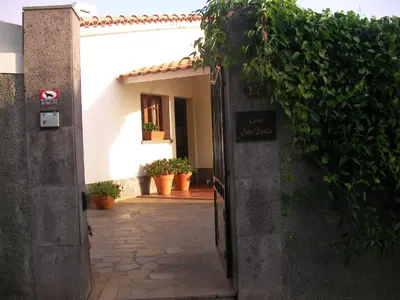 an entrance to a house with a sign that says car rental at Villa São Paulo in Funchal