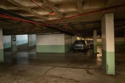 a parking garage with a car parked in it at Monumental Miramar Apartment by Rent-a-key in Funchal