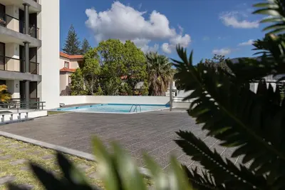 a swimming pool in the middle of a building at Monumental Miramar Apartment by Rent-a-key in Funchal