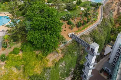an overhead view of a park with trees and a building at Acqua - Private Swimming Pool in Funchal