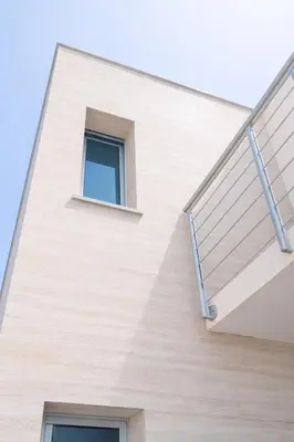 a building with a staircase and a window at Quinta do Munot in Raposeira do Logarinho