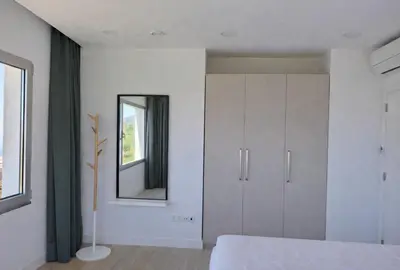 a bedroom with a mirror and a white cabinet at Quinta do Munot in Raposeira do Logarinho