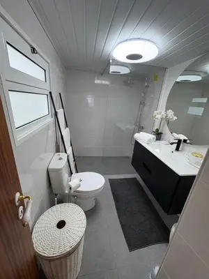 a bathroom with a toilet and a sink at The Blue Cottage in Gaula
