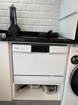 a white stove top oven in a kitchen at The Blue Cottage in Gaula